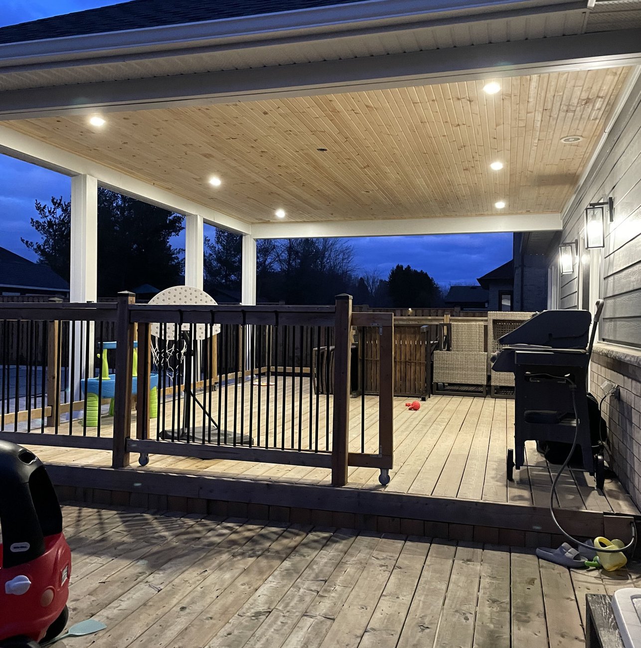 deck under a covered porch roof with pot lighting built near Woodstock Ontario